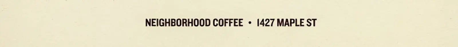 Close-up of the bottom of the Quality poster: an invented line reading NEIGHBORHOOD COFFEE and a made-up street address, 1427 MAPLE ST