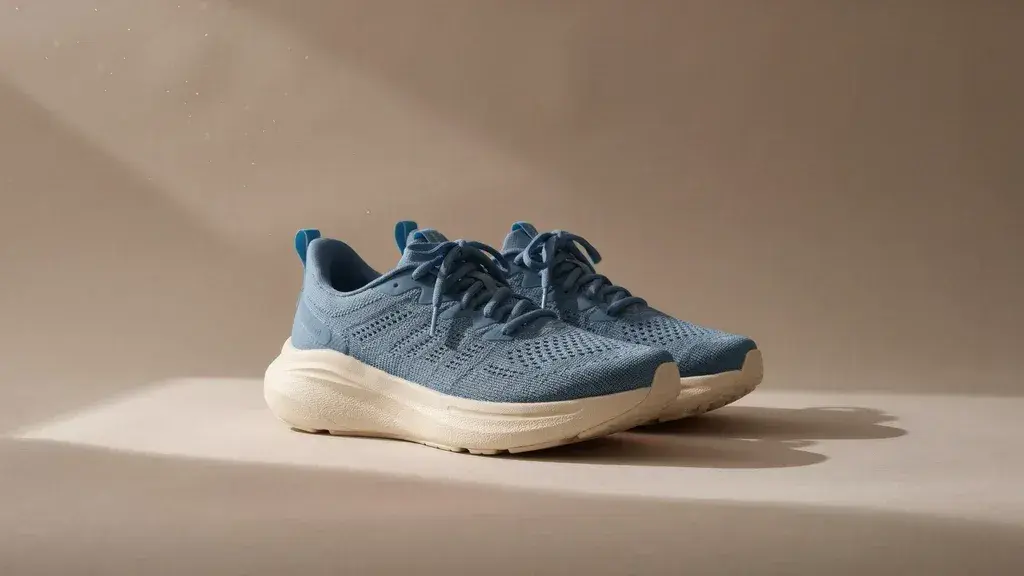 Official first edit with slate-blue shoes and a cream sole
